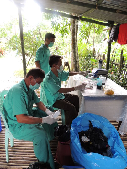 Field laboratory team prepares diagnostic slides using the Kato-Katz method - Ayeyarwady region, Myanmar