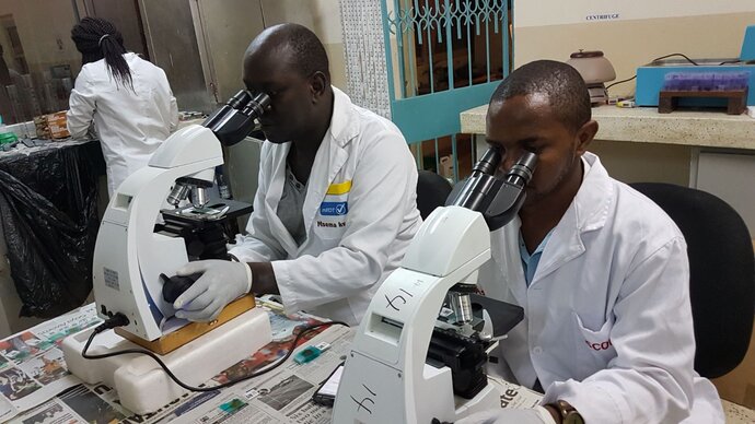 TUMIKIA lab technicians measuring the prevalence and intensity of STH infections
