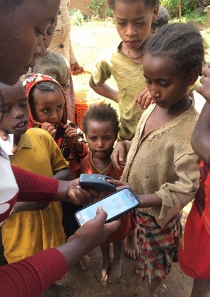 Taking finger prints to improve coverage and compliance of treatment. Image courtesy World Vision Ethiopia. 